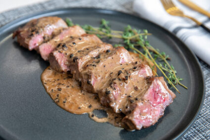 Peppercorn Strip Steak with Brandy Sauce